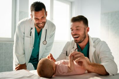 Pediatrician doctor examines baby. Healthcare, people, examination concept