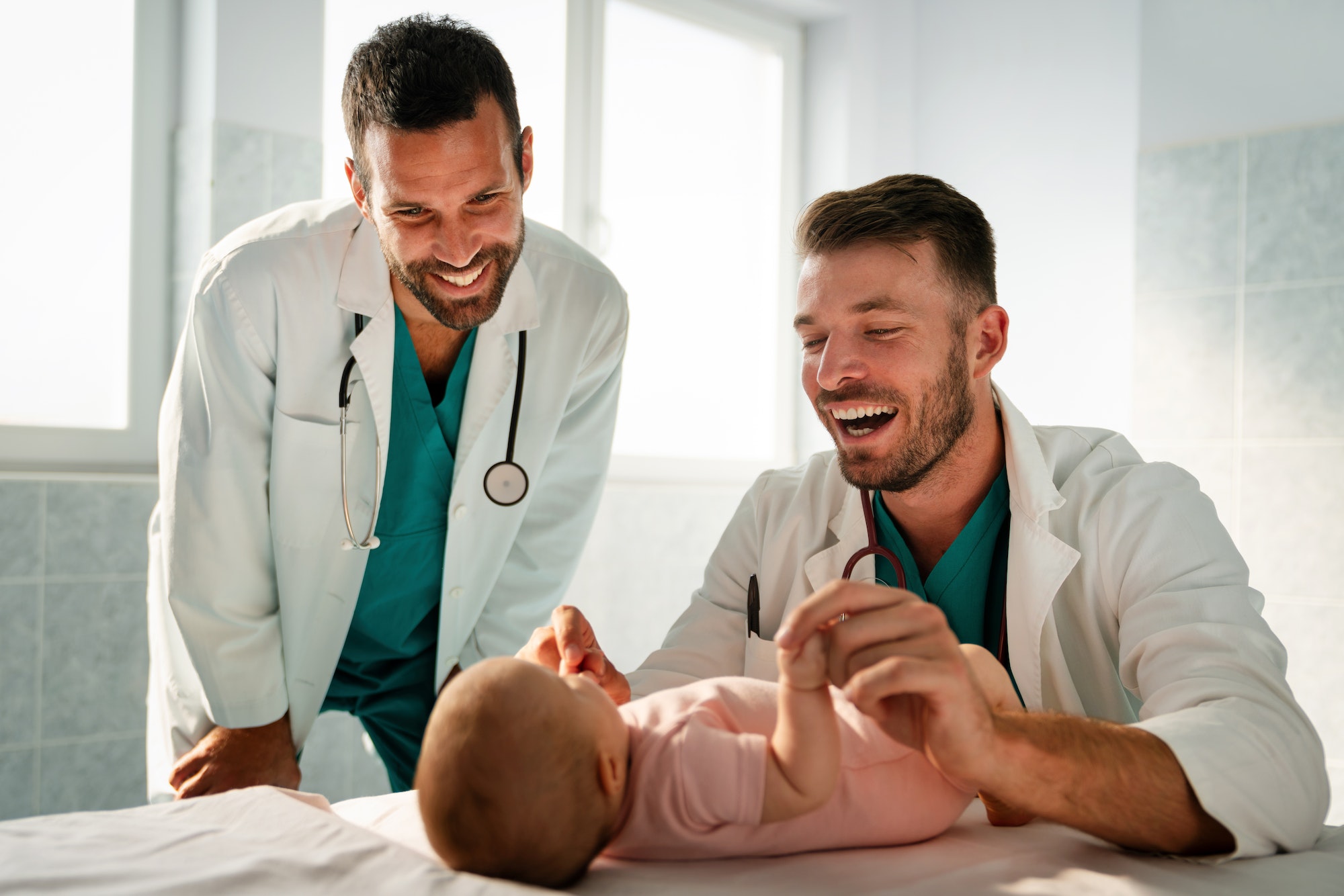 Pediatrician doctor examines baby. Healthcare, people, examination concept